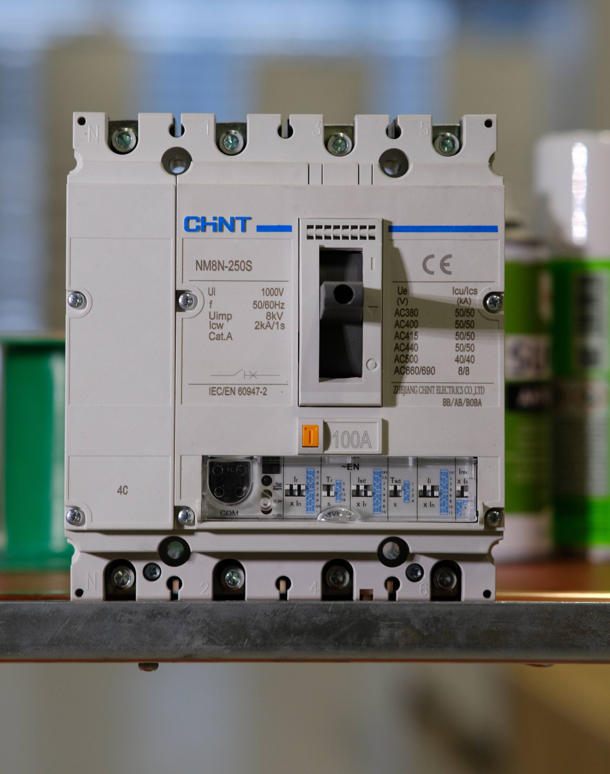 photograph of a chint circuit breaker with blurry background.
