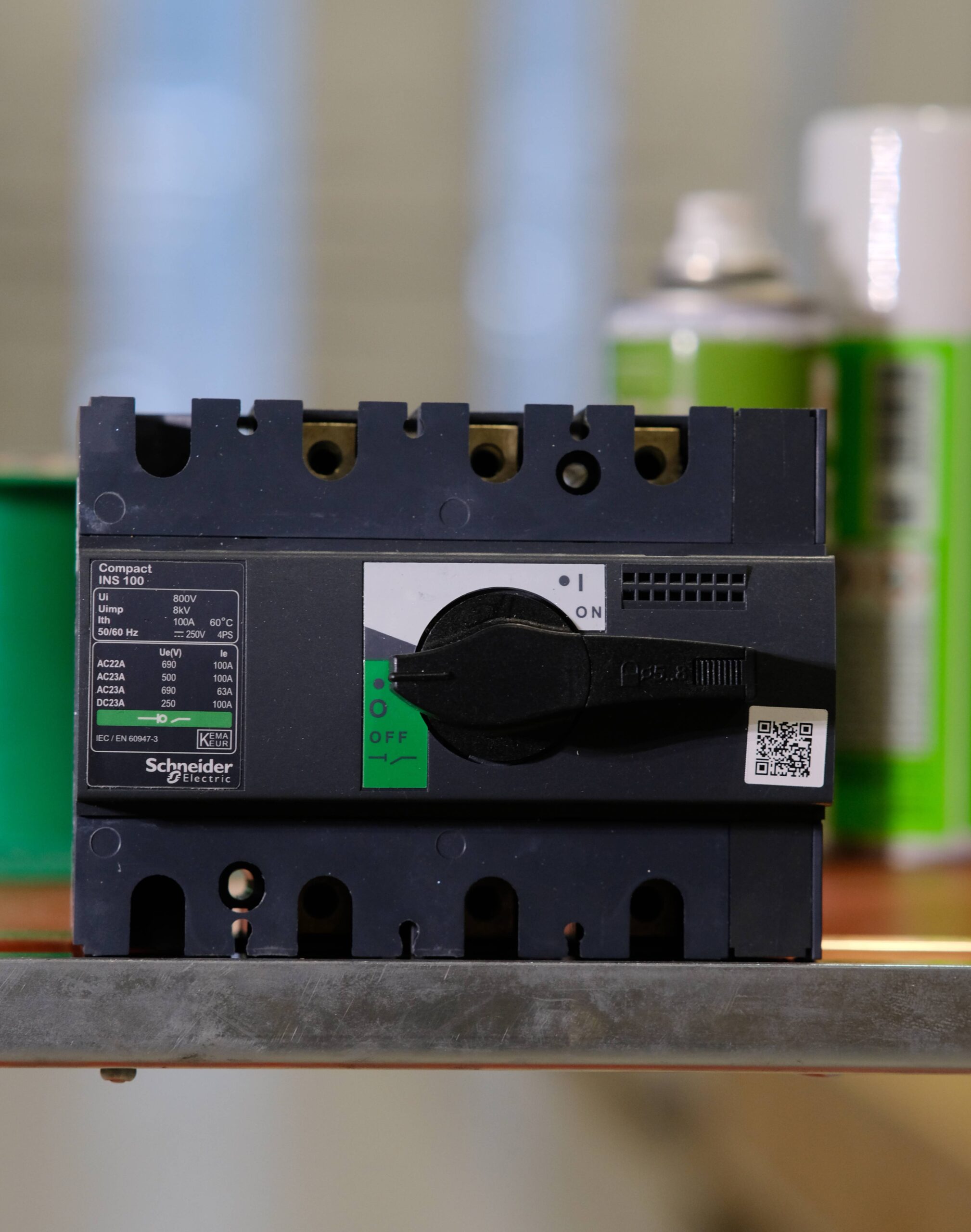 photograph of a Schneider circuit breaker with blurry background.